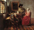 Une femme buvant et un gentilhomme baroque Johannes Vermeer